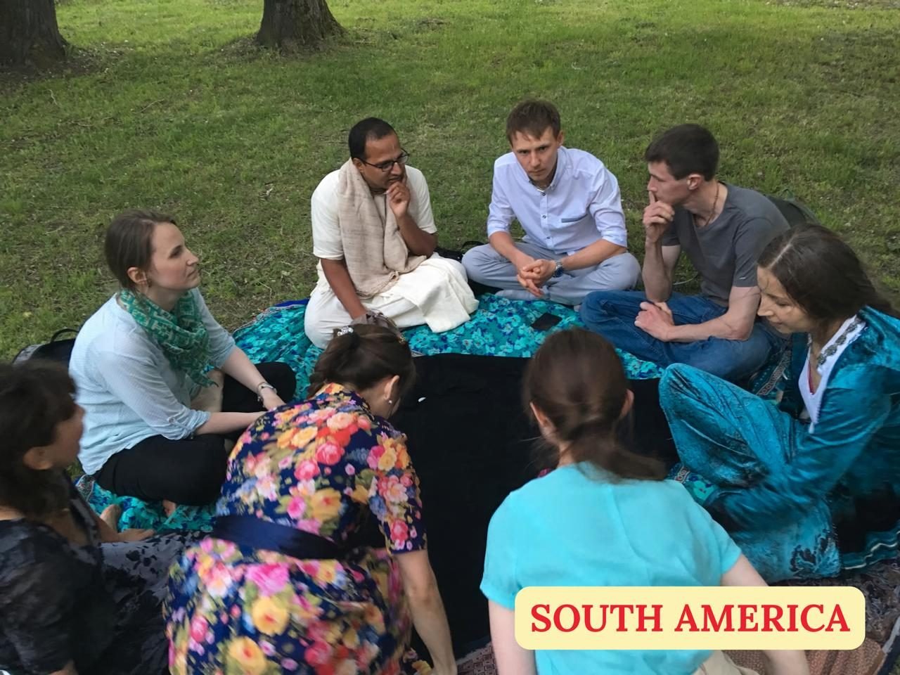 Brajsundar Das in a discussion circle with students in South America